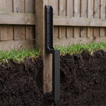 Fence post repair kit installed: lower half buried, upper half fixed to the post