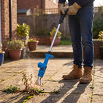 Man burning weeds in paving joints with the electric weed burner